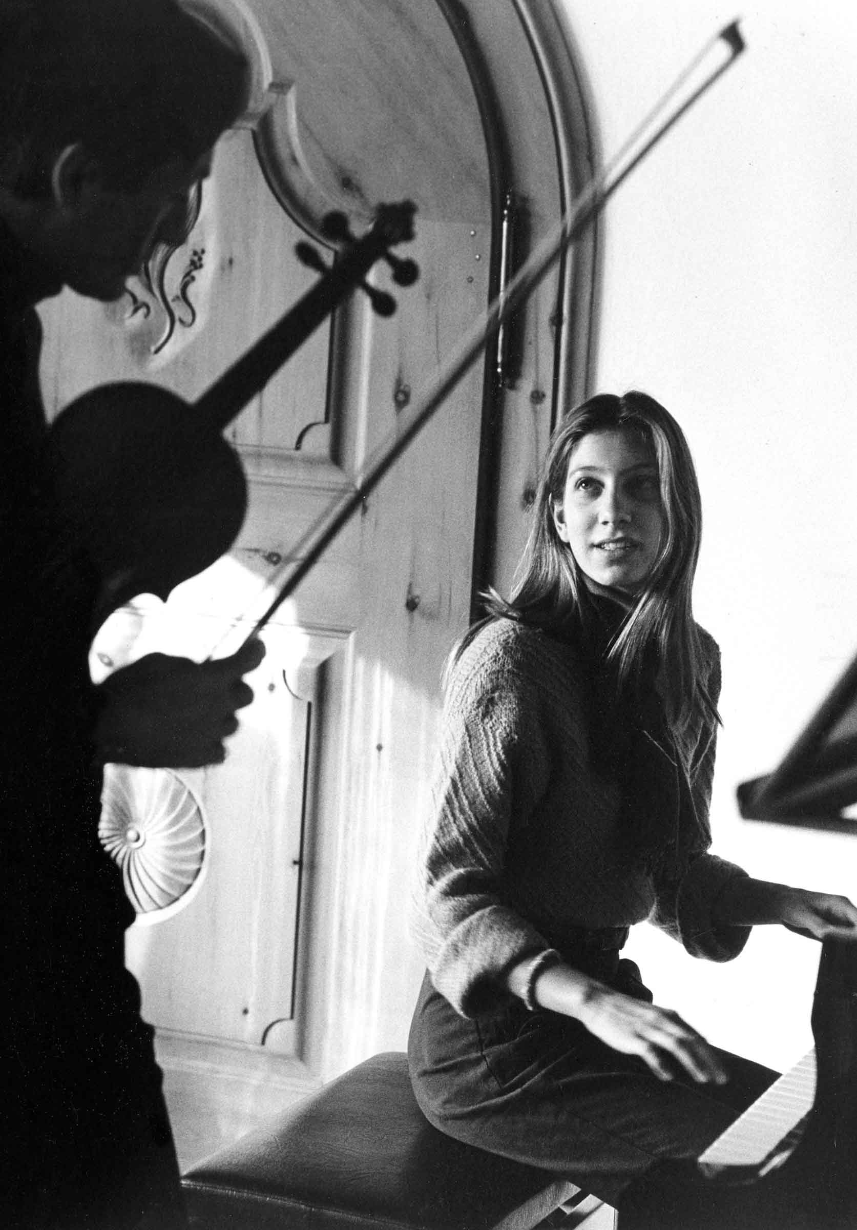 Eva 14 years old playing piano and her father playing violine