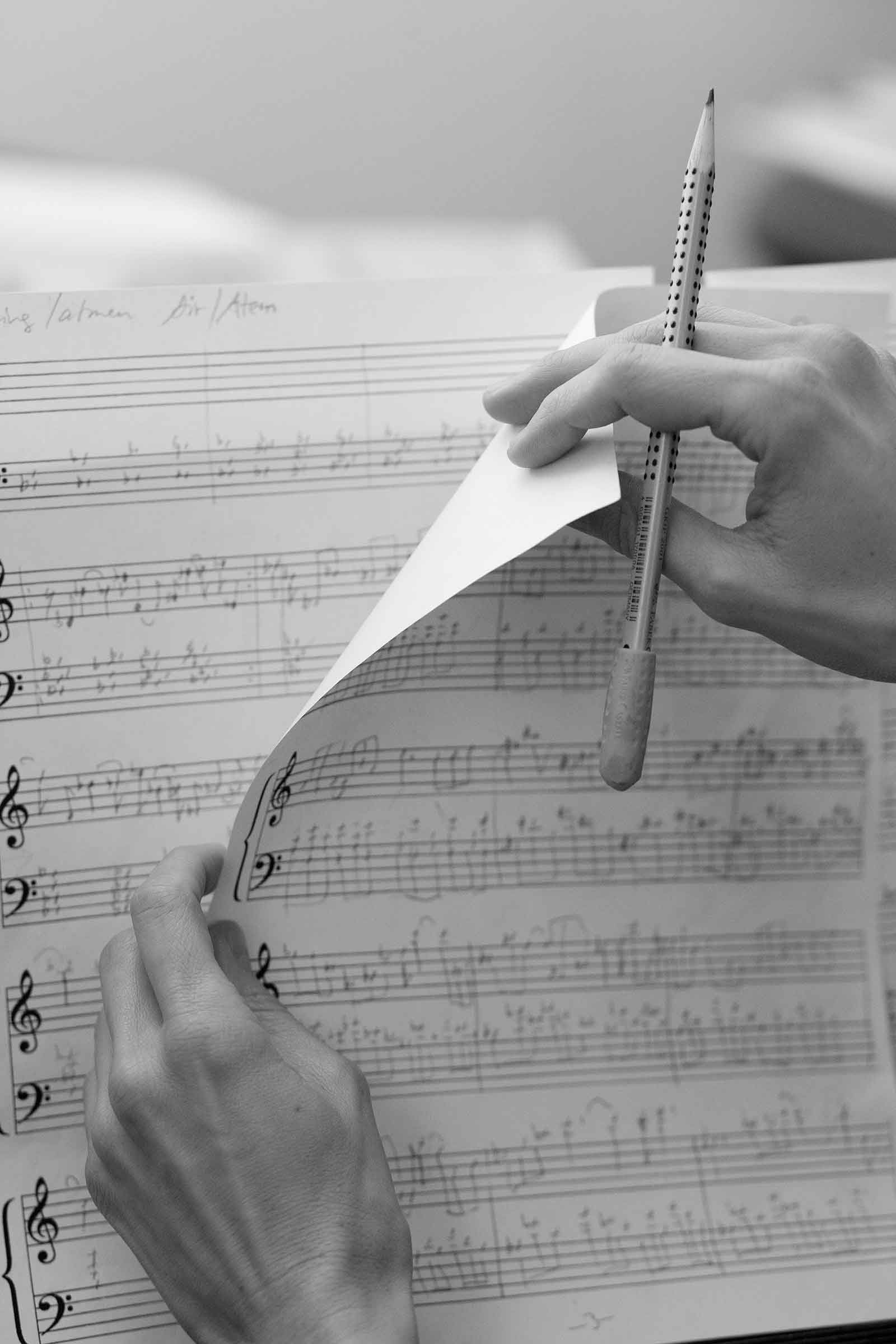 Eva turning a page from her composition