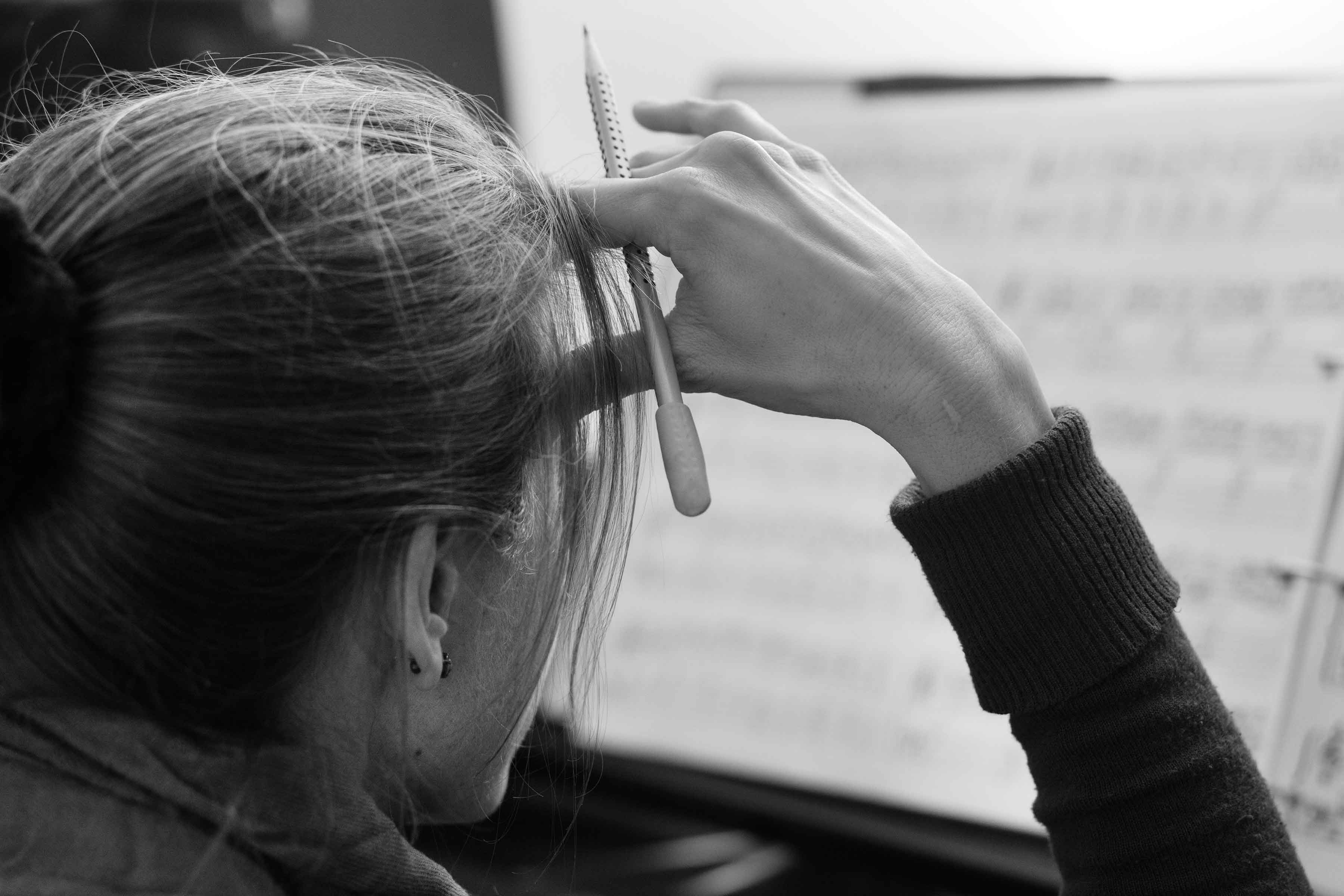 Eva composing at the piano
